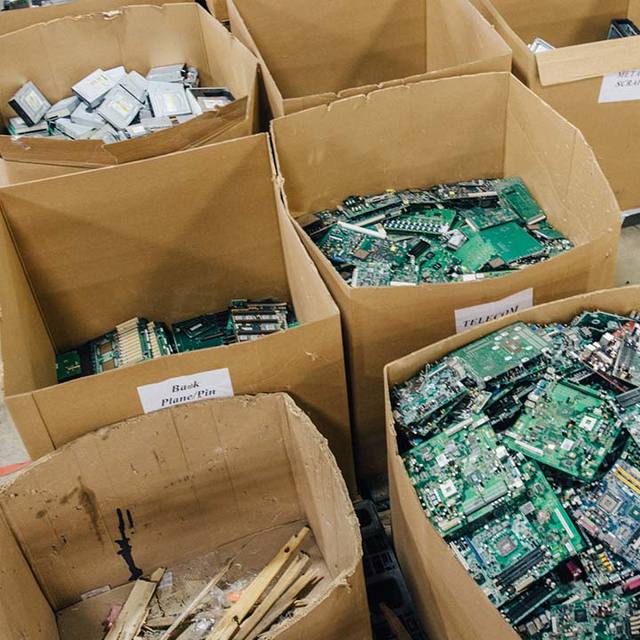 Paper bags containing circuit boards for recycling